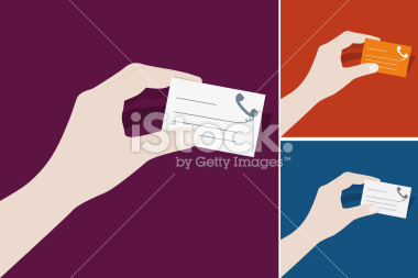 Hand holding a business card.