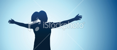 A teen girl with her arms oustretched in front of a sunset, feeling free.