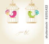 cute birds in golden cages
