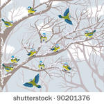 flock of blue tits perching on...