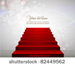 red carpet on stairs pointing...