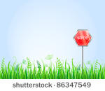 red stop sign on green grass...