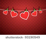 paper hearts hanging from a...