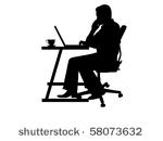 silhouette of a man typing at a ...